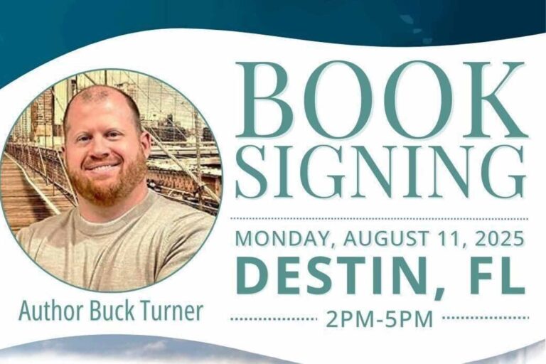 Author Buck Turner smiles in front of a scenic bridge backdrop.