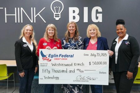 Eglin Federal Credit Union presents a $50,000 donation check to Westonwood Ranch.