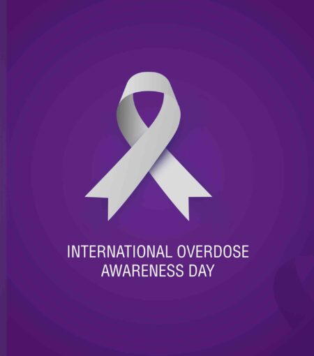 A purple awareness ribbon symbolizing overdose prevention.