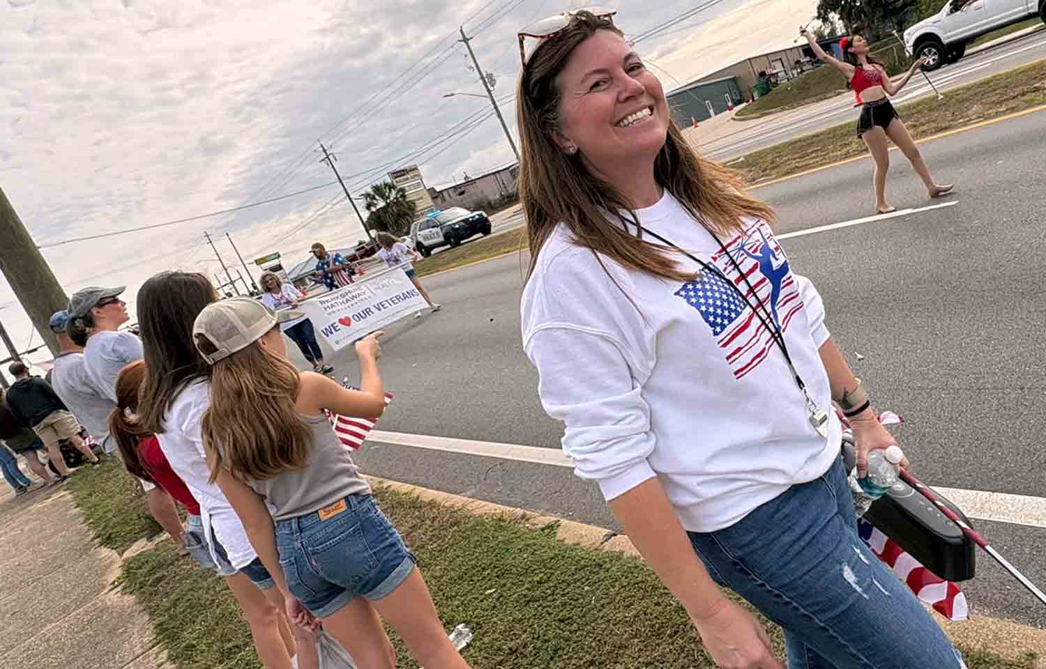 Spectators line John Sims Parkway to watch the City of Niceville Veterans Day Parade.