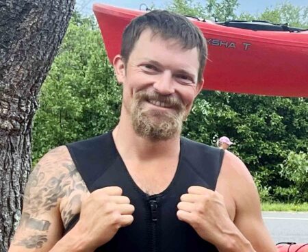Bret Valona, 36, of Walton County, pictured outdoors in a wetsuit.