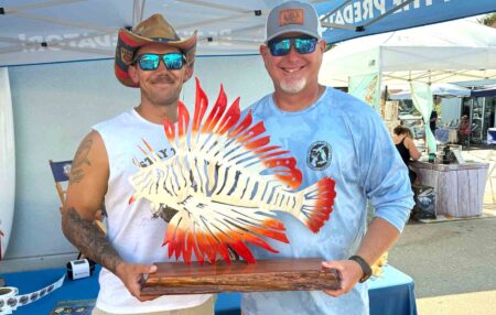 Donald Vautrinot receives the Commercial Champion award at the 2025 FWC Lionfish Challenge.