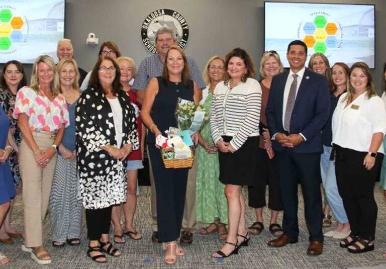 Group photo of Okaloosa County School District staff and leadership honoring Dr. Delilah Lewis’s appointment as math specialist.