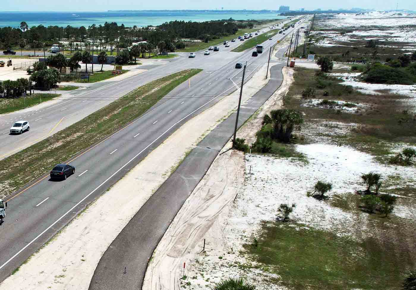 Aerial view of the Bridge-to-Bridge Multi-Use Path running parallel to U.S. 98 on Okaloosa Island.