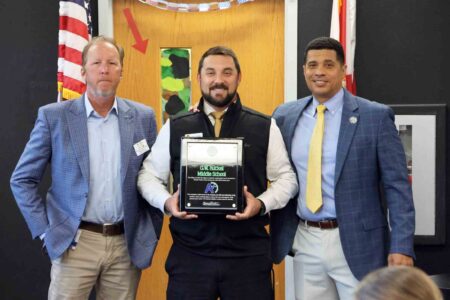 Ruckel Middle earns 23rd straight “A” grade and Florida School of Excellence honor Ruckel Middle School Principal Jannazo with Superintendent Marcus Chambers and School Board Member Brett Hinely holding the A+ Plaque.