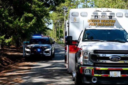 Walton County Sheriff’s Office patrol vehicle and South Walton Fire District ambulance at the scene of a deadly shooting on Pinehurst Drive in Santa Rosa Beach.