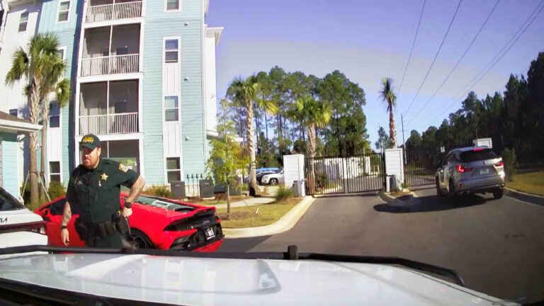 WCSO deputies say Lamborghini driver ran after abandoning car A Walton County Sheriff’s Office deputy stands beside a red sports car parked in front of an apartment building inside a gated complex.