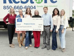Bloody Mary Festival at The Market Shops raises $28,000 Representatives from The Market Shops and Habitat for Humanity of Walton County pose together holding a $28,000 donation check in front of a Habitat ReStore truck.