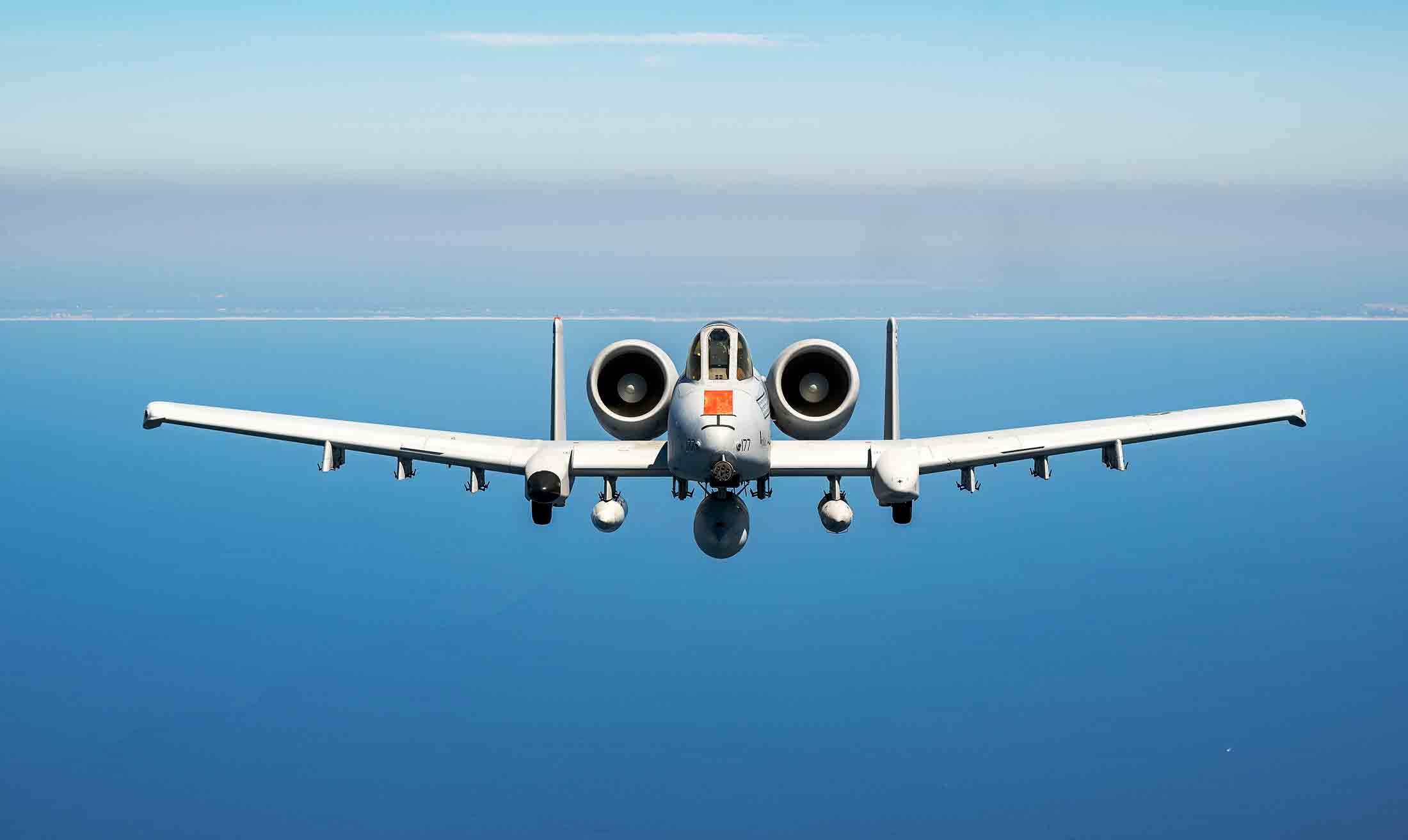 A U.S. Air Force A-10C Thunderbolt II flies over the Gulf of Mexico during a test mission.