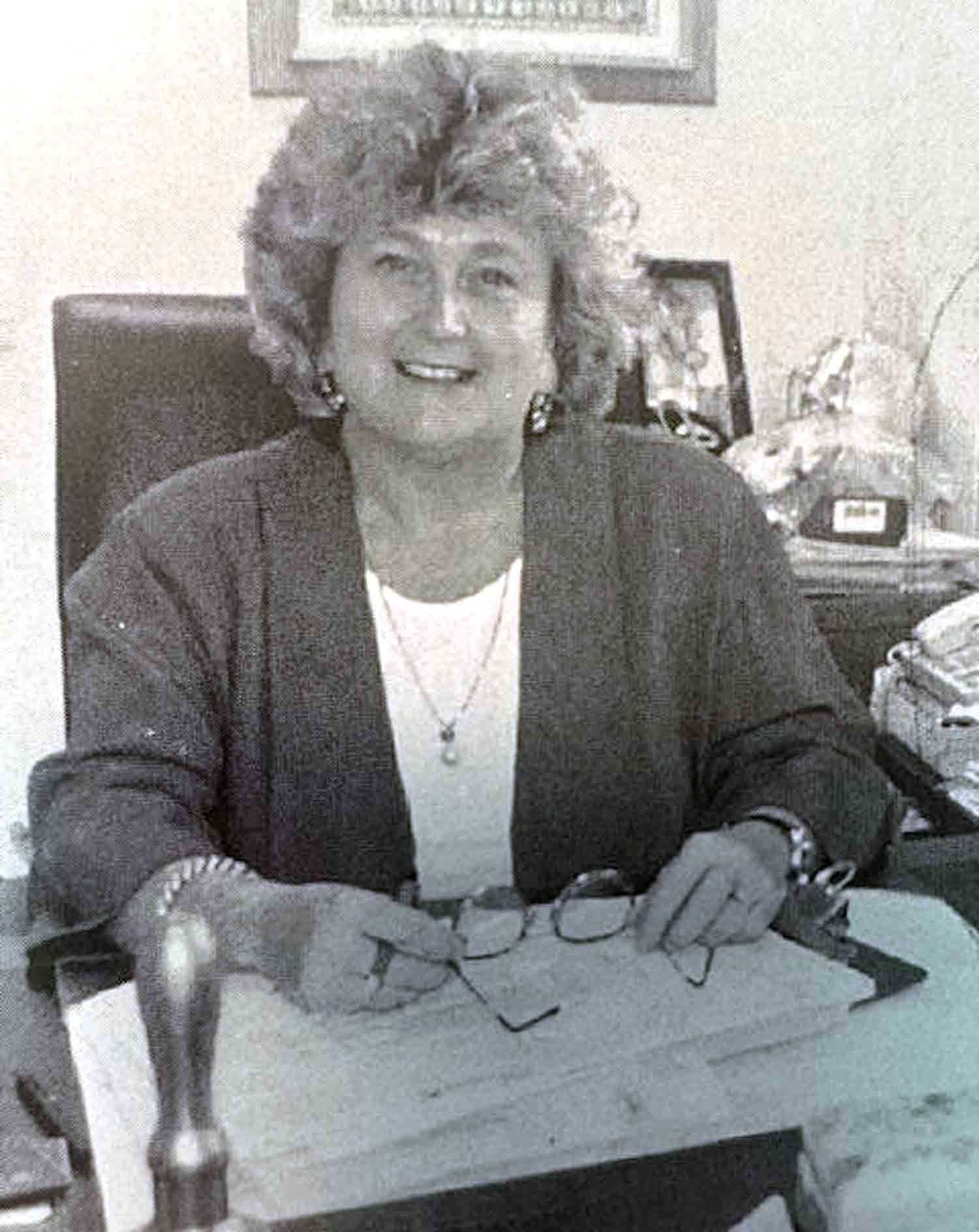 Former Ruckel Middle School principal Dr Ginny Morgan seated at her desk