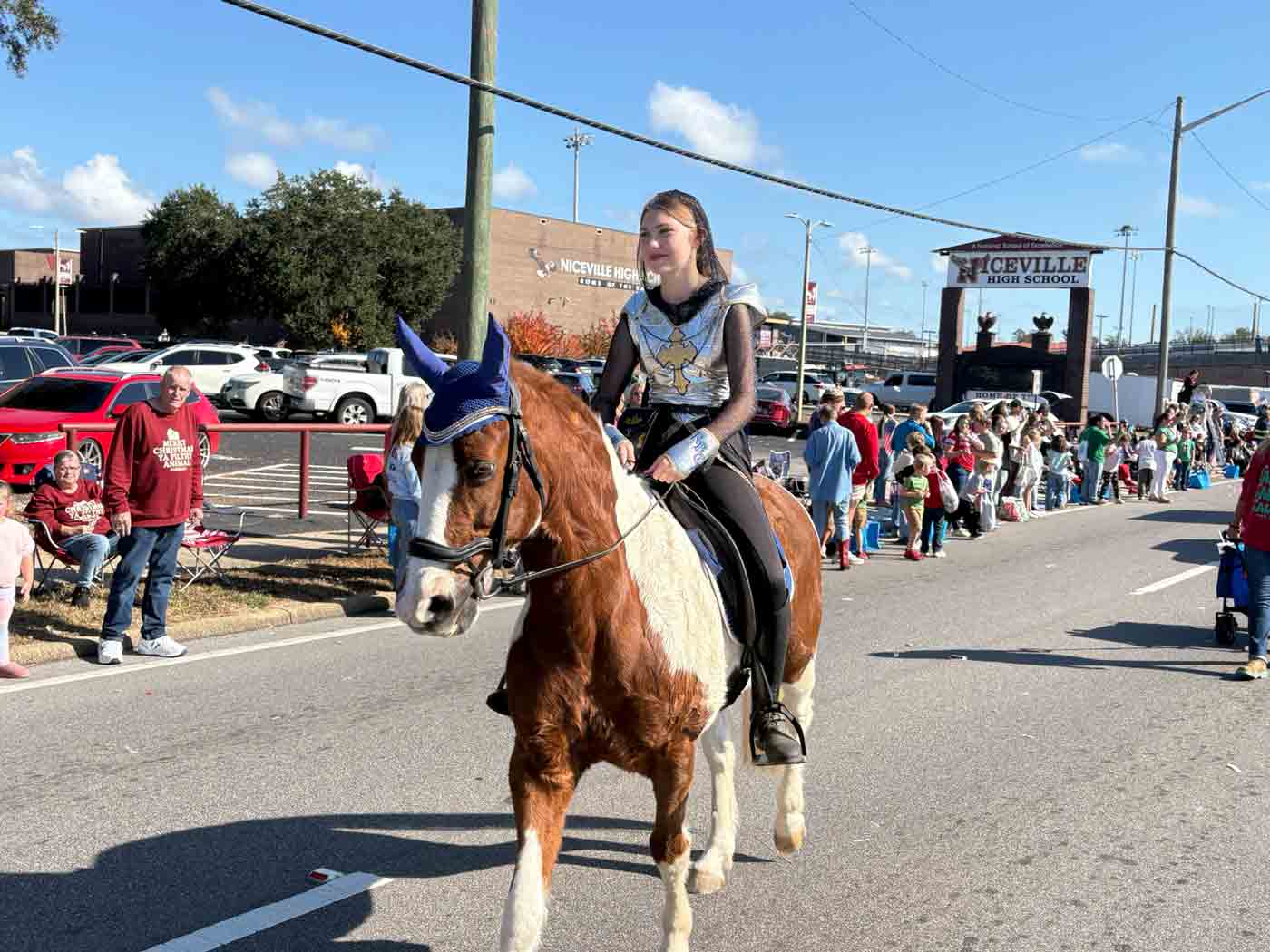 A rider from Rocky Bayou Christian School rides a horse during the Niceville-Valparaiso Community Christmas Parade.