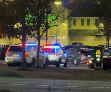 Reckless driving call leads to meth trafficking arrest in Walton County Walton County Sheriff’s Office patrol vehicles with emergency lights activated during a nighttime traffic stop in a shopping center parking lot.