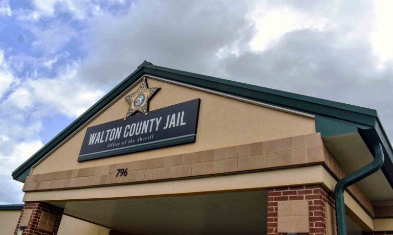 Receipt and FLOCK help WCSO track suspected Lululemon thefts The front entrance of the Walton County Jail building under a cloudy sky.