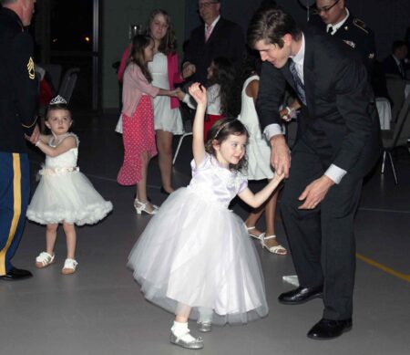Father–daughter dance returns to Holy Name of Jesus for 10th year Father and daughter dance together during the first Knights of Columbus father–daughter dance in 2016.
