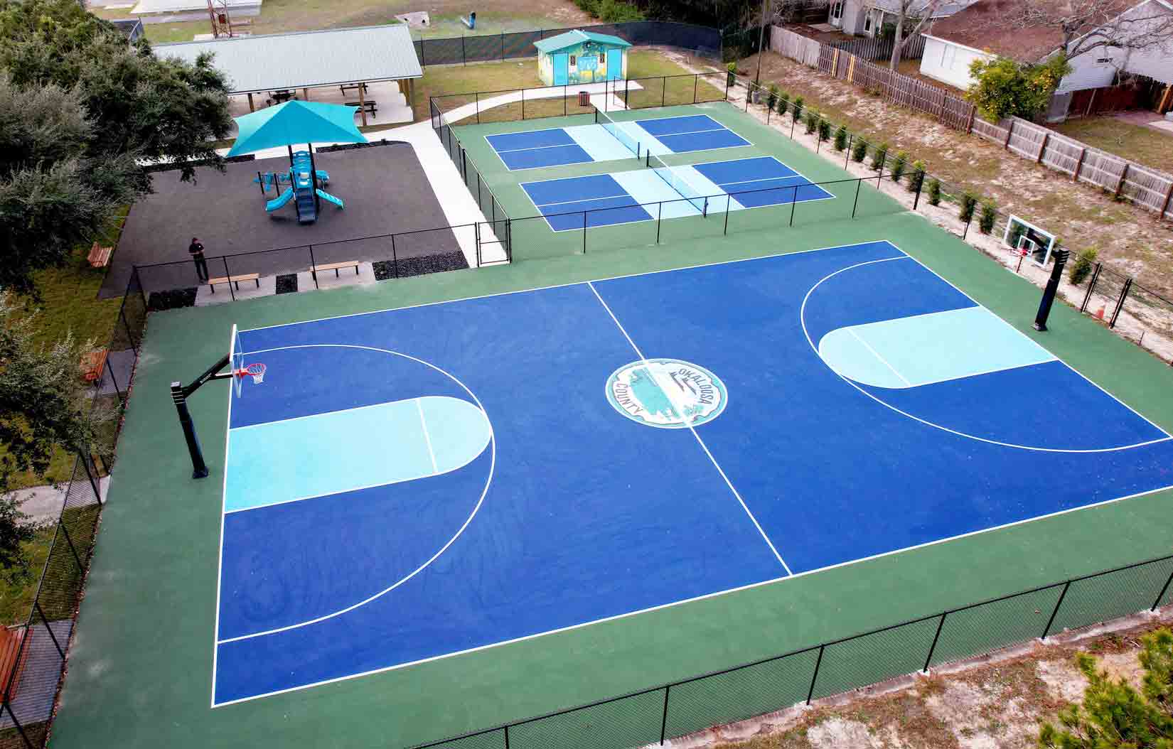An aerial view of newly renovated basketball and pickleball courts at Brigadier General Bud Day Park in Mary Esther.
