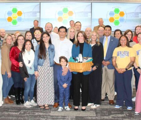 Okaloosa County School District staff and school leaders pose for a group photo during the January 26, 2026, school board meeting recognizing Mandy Lopez’s appointment as principal of Destin Middle School.