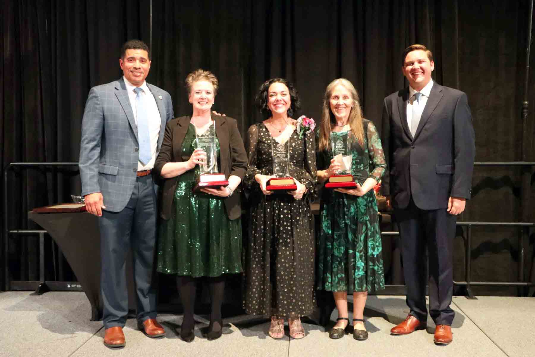 Kimberly Day-Scanlon stands with Teacher of the Year runners-up during the Okaloosa County School District recognition ceremony.