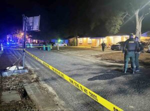 Deputies secure the scene of a drive-by shooting outside a home in Shalimar Thursday night.