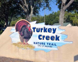 Turkey Creek restrooms reopen after upgrades Entrance sign for Turkey Creek Nature Trail in Niceville, Florida, featuring a painted wild turkey and the words “Turkey Creek Nature Trail – City of Niceville.”