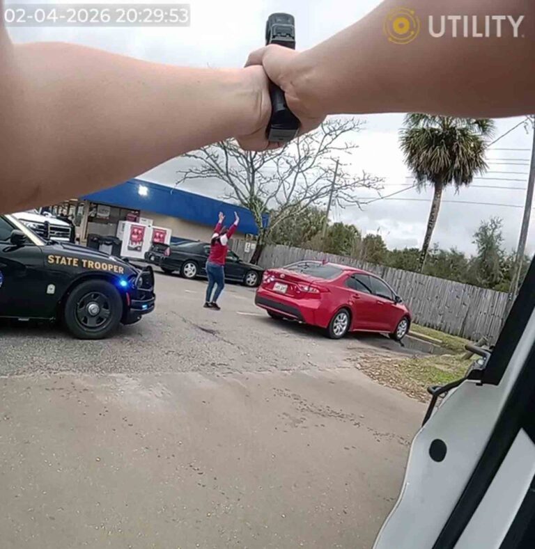 Fugitive nabbed with $150K, gun during Mossy Head stop: WCSO Law enforcement officers conduct a felony traffic stop as a woman stands with her hands raised near a red sedan and a marked Florida Highway Patrol vehicle.