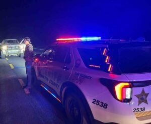 Walton County Sheriff’s Office deputy conducts a nighttime traffic stop on U.S. 331 involving a pickup truck.