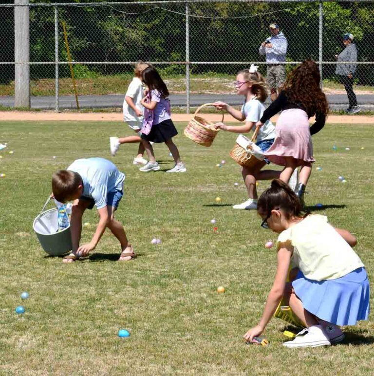 Children gather colorful plastic eggs during the City of Niceville Egg Dash at the Niceville Recreation Complex.