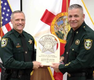 Okaloosa deputy named Deputy of the Year after 2,655 calls Okaloosa County Sheriff Eric Aden presents Deputy Jason Register with the 2025 Deputy of the Year award during a recognition ceremony.