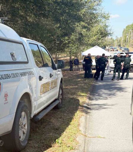 Okaloosa County Sheriff’s Office crime scene unit truck parked along a rural roadway while deputies investigate a fatal shooting in north Okaloosa County.