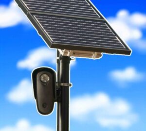 Solar-powered license plate reader camera mounted on a pole against a blue sky.