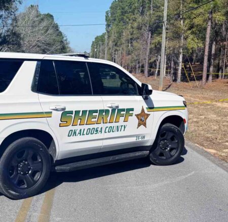 Okaloosa County Sheriff’s Office patrol SUV parked on a rural roadway during a homicide investigation near Crestview.