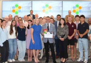 Charlie Marello stands with family, students and staff after being named OCSD Director of Human Resources