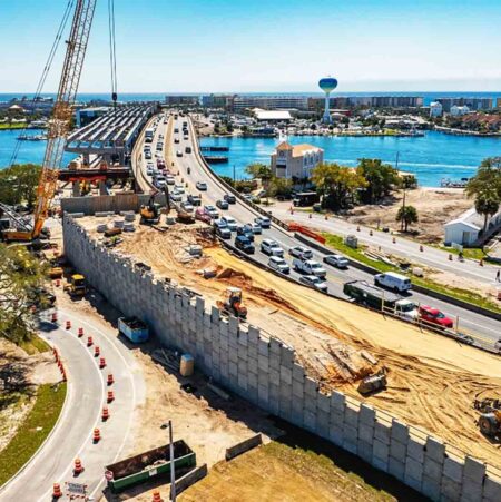 Aerial view of Brooks Bridge construction with traffic and equipment in Fort Walton Beach