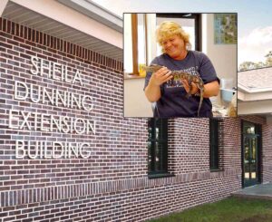 New Extension building opens April 23, honors Dunning Sign for Sheila Dunning Extension Building with inset photo of Dunning holding an alligator