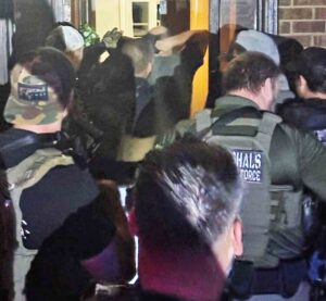 U.S. Marshals task force arrests fugitive in Walton County Law enforcement officers with a U.S. Marshals Task Force take a suspect into custody inside a residence during an early morning arrest.