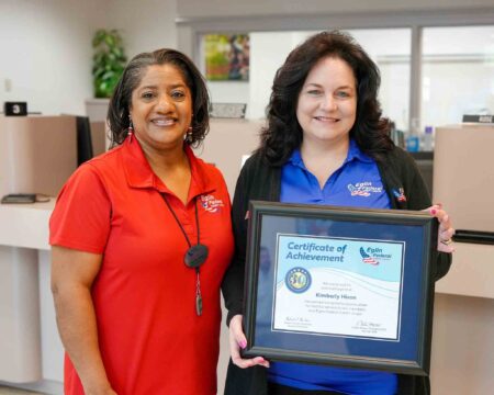 30-year employee promoted as Eglin FCU celebrates milestone Two Eglin Federal Credit Union employees pose with a framed certificate recognizing Kimberly Hixon for 30 years of service.