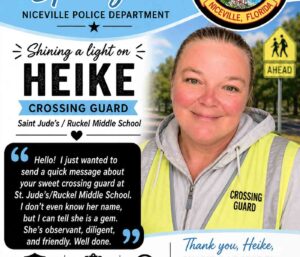 Niceville crossing guard Heike Noonkester stands in uniform during a Niceville Police Department Employee Spotlight feature.