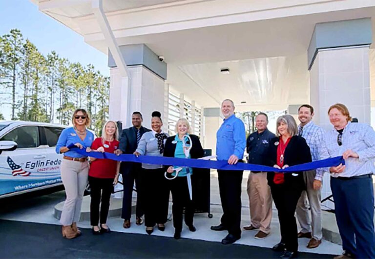 Eglin Federal Credit Union employees and community members participate in a ribbon-cutting ceremony at the new ATM and Video Teller drive-thru location in Santa Rosa Beach.