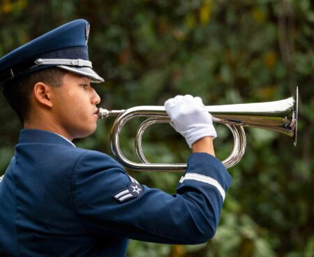 Airman 1st Class Christian Deleo of the Eglin Honor Guard plays Taps during the 57th Annual Explosive Ordnance Disposal Memorial ceremony at Eglin Air Force Base.