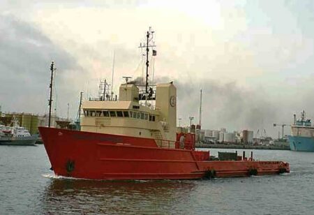 The 224-foot Henry Alex vessel travels through a harbor before its planned conversion into the Sposit Reef, an artificial reef off the Emerald Coast.