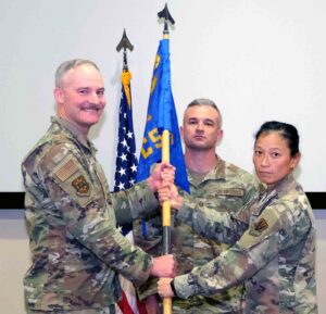 U.S. Air Force Col. Terry Hjerpe transfers the 505th Communications Squadron guidon during a change of command ceremony at Hurlburt Field as Lt. Col. Justin Raynor assumes command from outgoing commander Lt. Col. Crystal Lusardi on June 18, 2026.