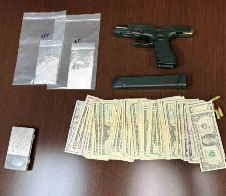 Evidence recovered during a Crestview traffic stop includes suspected fentanyl, cash, a Glock handgun, ammunition and an illegal machine gun conversion device. (Contributed)