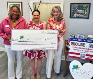 Niceville-based PBMRI donates $2,250 to local nonprofits Representatives of the Emerald Coast Children's Advocacy Center accept a $1,000 donation from the PhotoBioModulation Research Institute.