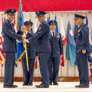 Maj. Gen. Scott A. Cain presents the 96th Test Wing guidon to Col. Chris Keithley during a change of command ceremony at the McKinley Climatic Lab at Eglin Air Force Base on June 16, 2026.
