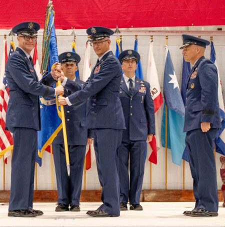 Maj. Gen. Scott A. Cain presents the 96th Test Wing guidon to Col. Chris Keithley during a change of command ceremony at the McKinley Climatic Lab at Eglin Air Force Base on June 16, 2026.