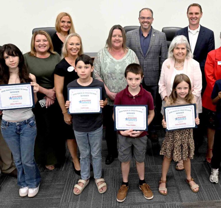 Eglin FCU celebrates young savers in Teach Children to Save campaign Winners of the 2026 Okaloosa Saves Teach Children to Save campaign pose with representatives from Eglin Federal Credit Union, Okaloosa Saves, participating financial institutions and local officials after a recognition ceremony in Fort Walton Beach.