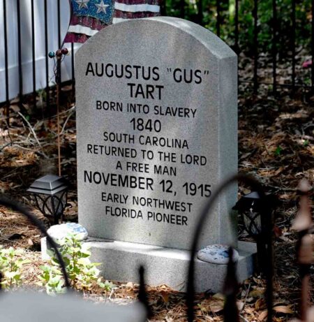 Gravestone of Augustus “Gus” Tart, an early Northwest Florida pioneer who was born into slavery in 1840 and died a free man in 1915.